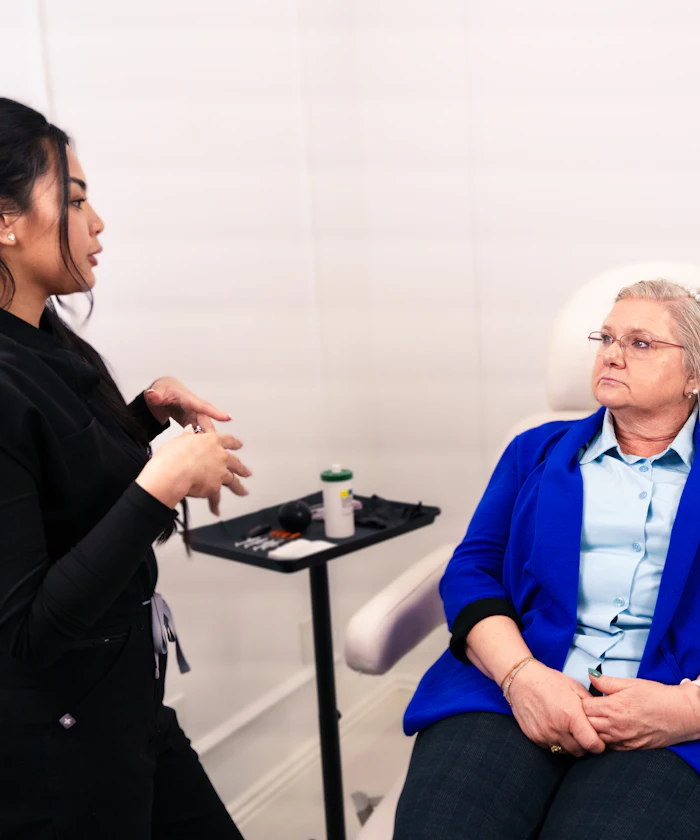 Clinician consulting with a seated client